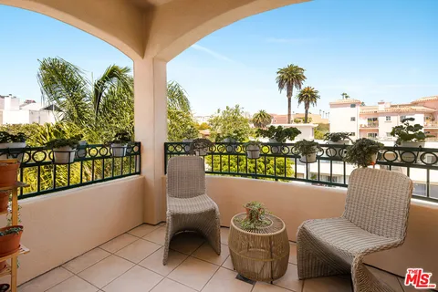 a view of a chairs and table in patio
