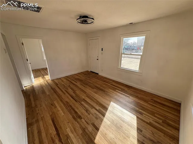 a view of an empty room and window