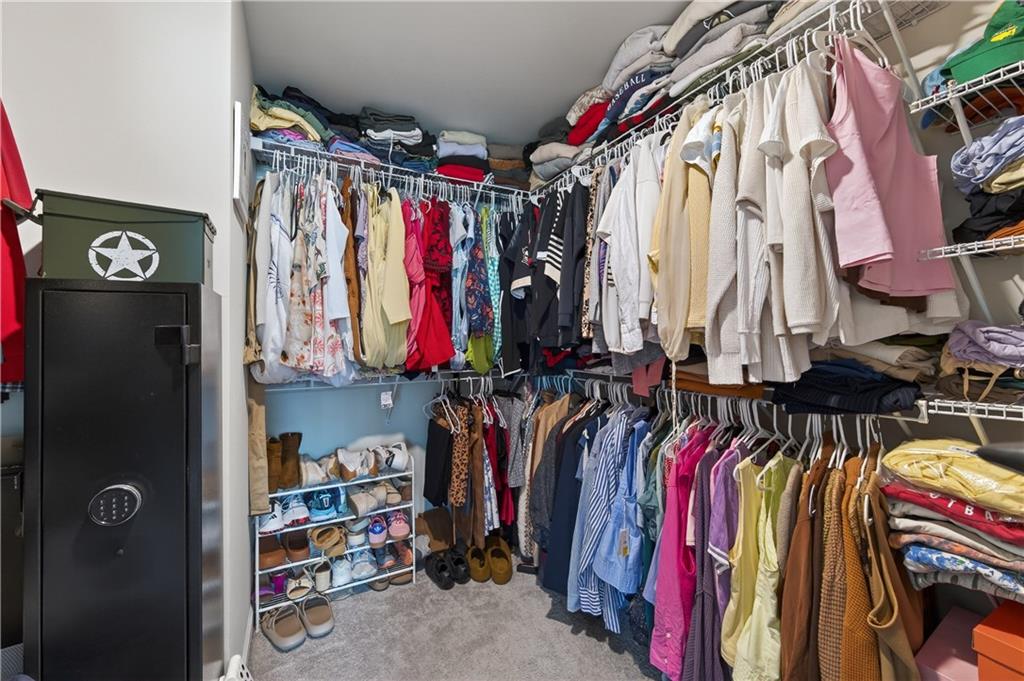 266 Shoals Bridge Road Acworth, GA 30102 - Photo 27 of 43 a view of walk in closet with clothes