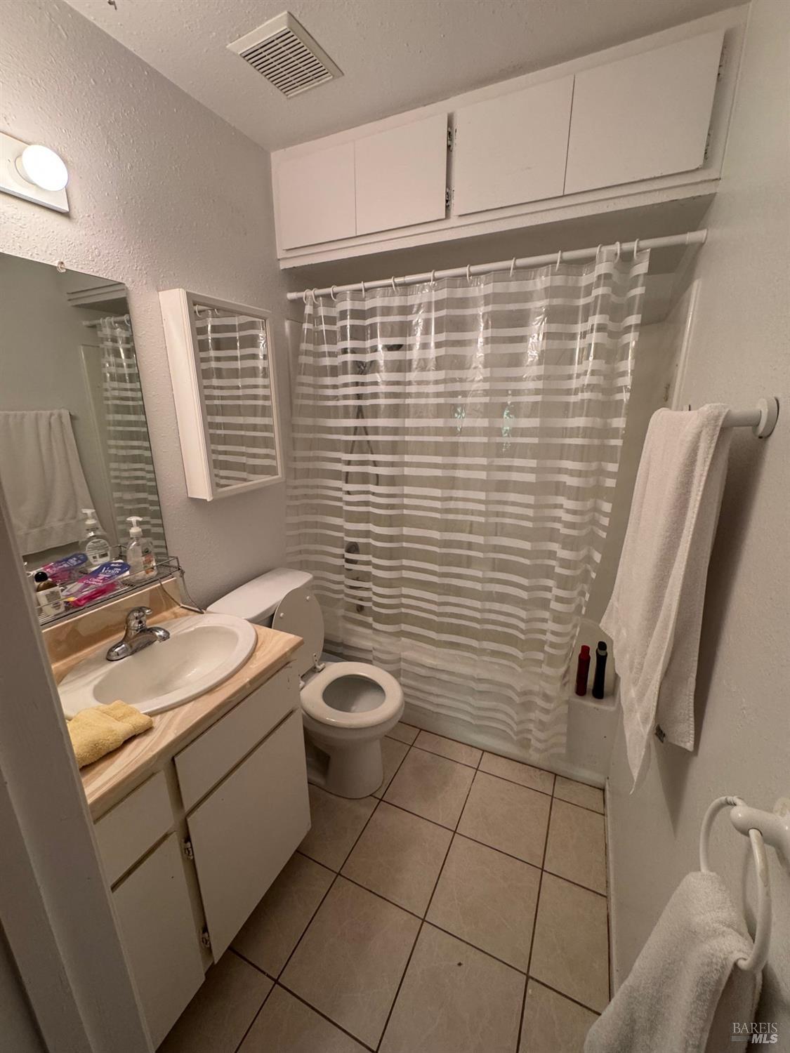 896 Sanitarium Road Deer Park, CA 94574 - Photo 16 of 20 a bathroom with a sink toilet and shower
