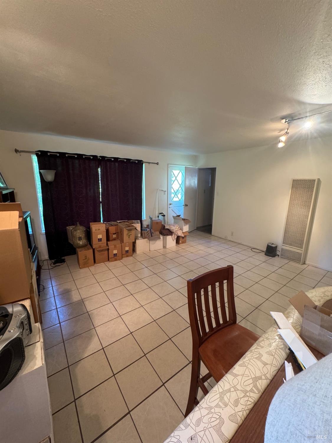 896 Sanitarium Road Deer Park, CA 94574 - Photo 17 of 20 a large bedroom with a bed and wooden floor