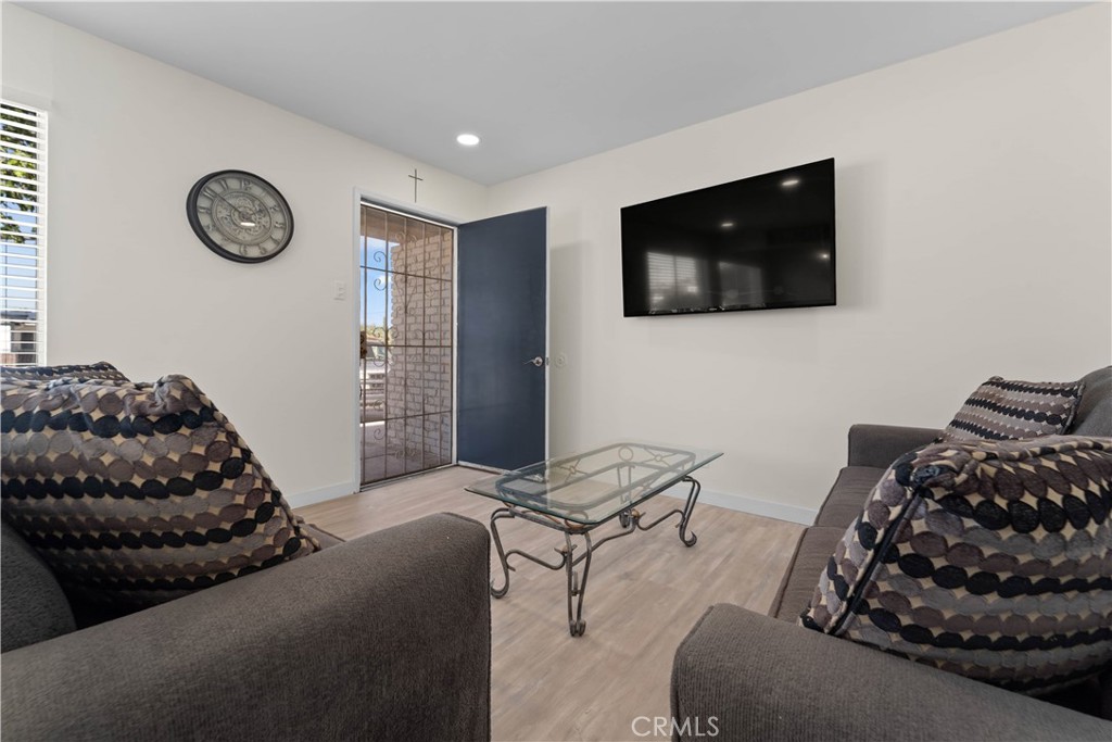 1836 Sunrise Road Barstow, CA 92311 - Photo 7 of 16 a living room with furniture and a flat screen tv
