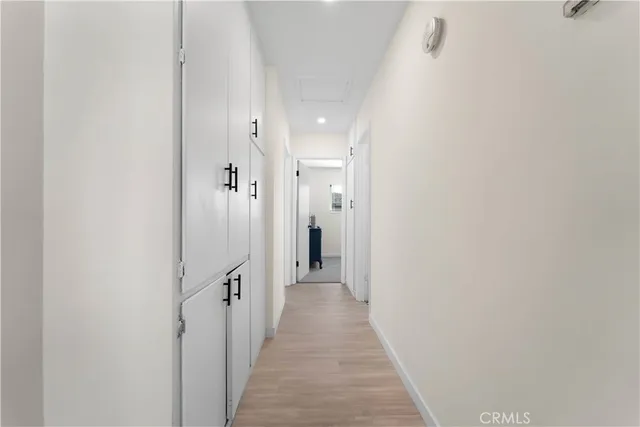 a view of a hallway with white walls