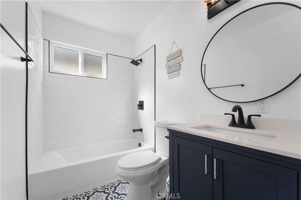 1836 Sunrise Road Barstow, CA 92311 - Photo 9 of 16 a bathroom with a sink a toilet and a mirror