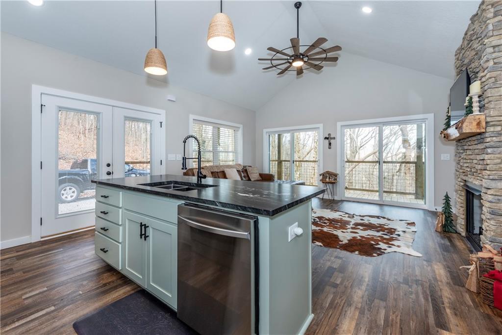 110 Burnt Mountain Cove Road Jasper, GA 30143 - Photo 23 of 33 a kitchen with a counter space a sink appliances and a window