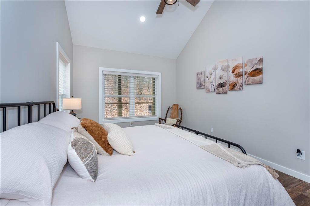 110 Burnt Mountain Cove Road Jasper, GA 30143 - Photo 26 of 33 a bedroom with a bed and a window