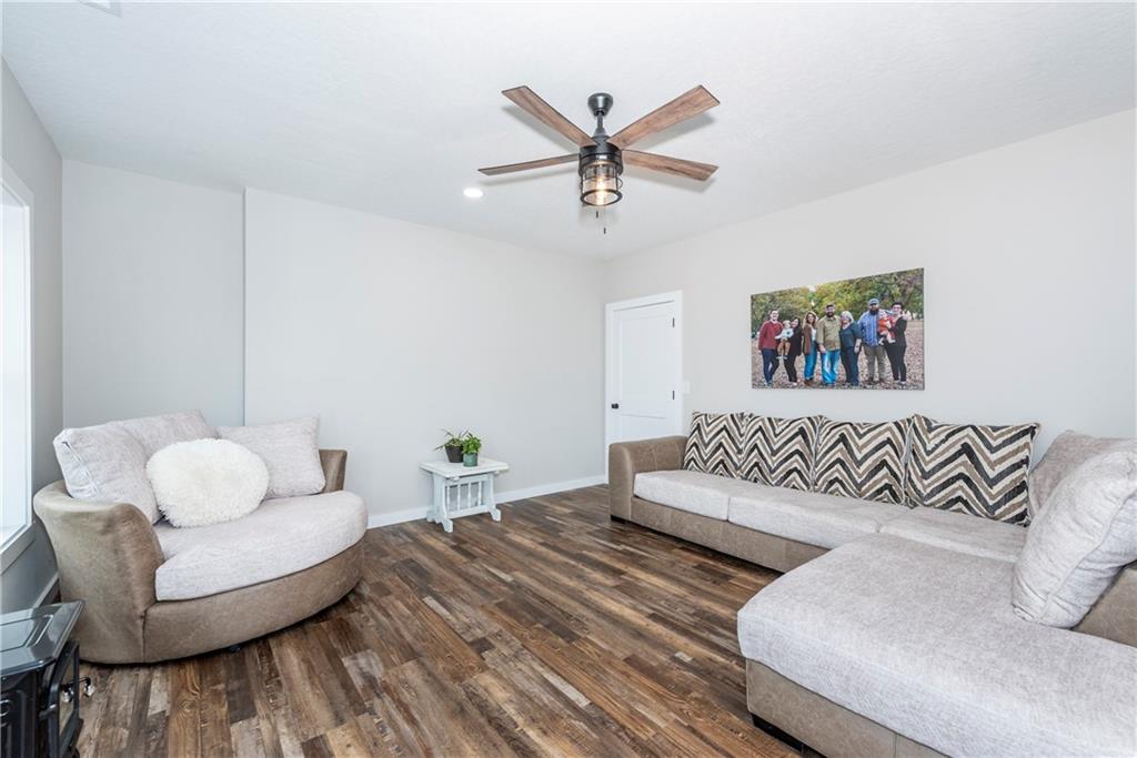 110 Burnt Mountain Cove Road Jasper, GA 30143 - Photo 29 of 33 a bedroom with furniture and a wooden floor