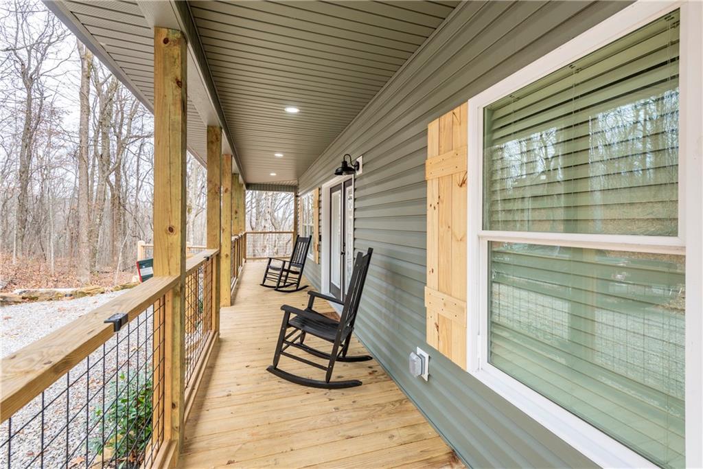 110 Burnt Mountain Cove Road Jasper, GA 30143 - Photo 9 of 33 a view of a balcony with chairs