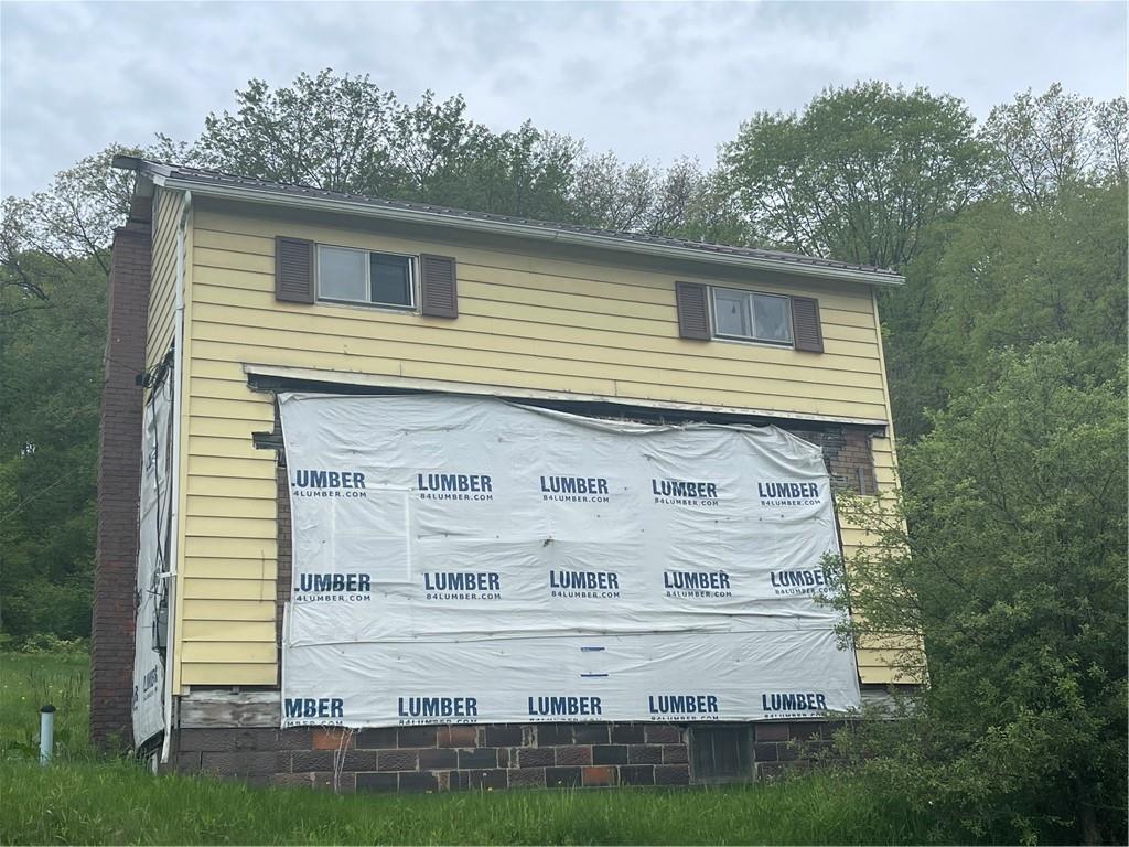 110 Pa-210 Home, PA 15747 - Photo 13 of 14 a front view of a house with a yard