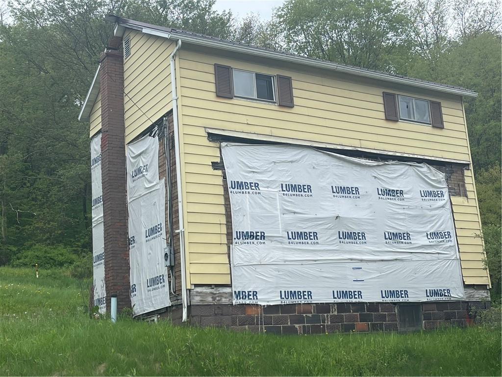 110 Pa-210 Home, PA 15747 - Photo 14 of 14 a front view of a house with a garden