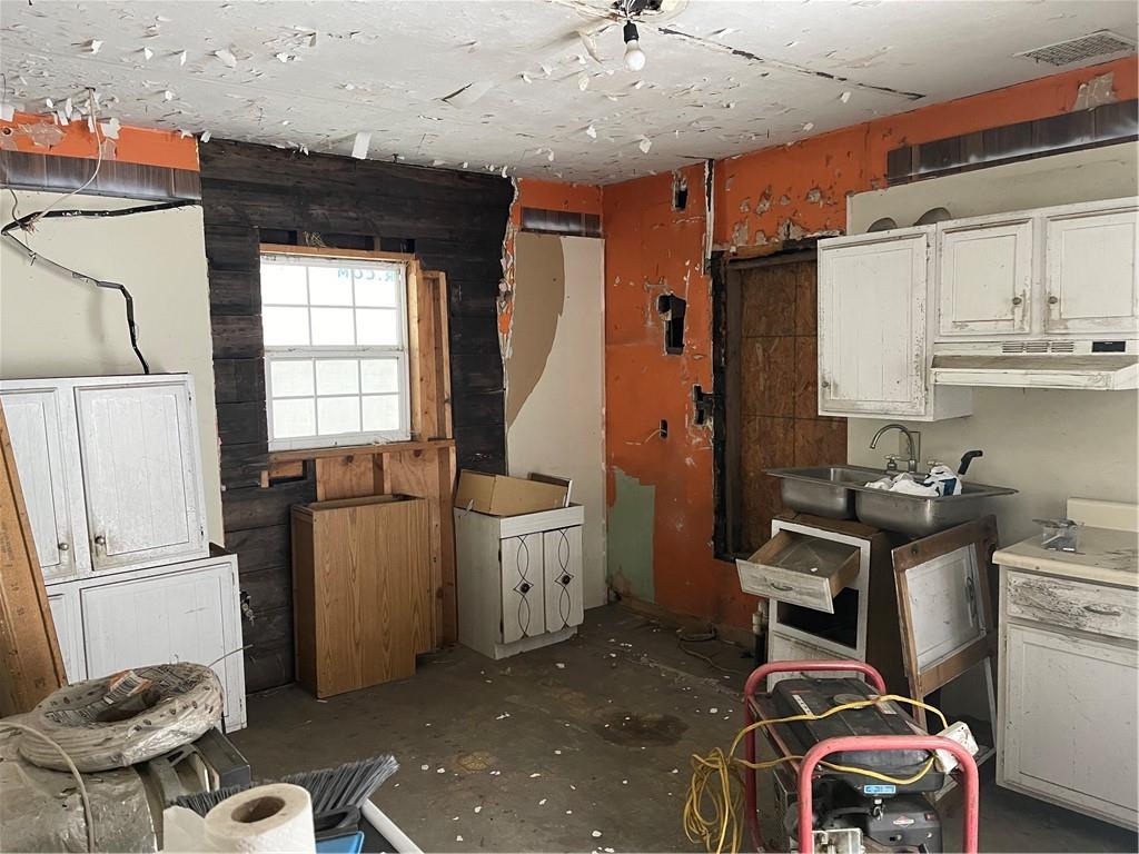 110 Pa-210 Home, PA 15747 - Photo 9 of 14 a kitchen with a refrigerator and a sink