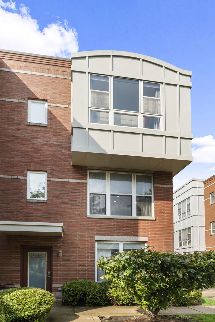 3238 North Kilbourn Avenue, Unit 1 Chicago, IL 60641 - Photo 1 of 17 a view of a brick building next to a yard