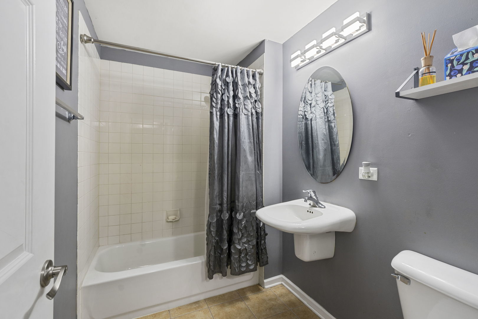 3238 North Kilbourn Avenue, Unit 1 Chicago, IL 60641 - Photo 16 of 17 a bathroom with a sink toilet and shower