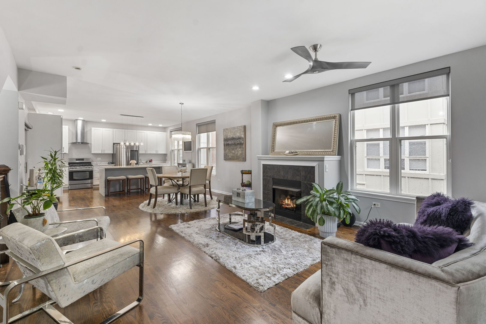 3238 North Kilbourn Avenue, Unit 1 Chicago, IL 60641 - Photo 2 of 17 a living room with furniture fireplace and potted plants