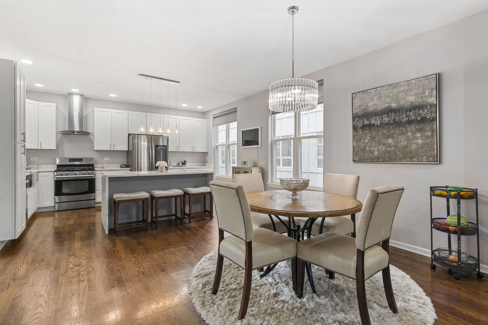 3238 North Kilbourn Avenue, Unit 1 Chicago, IL 60641 - Photo 5 of 17 a view of a dining room with furniture window and wooden floor