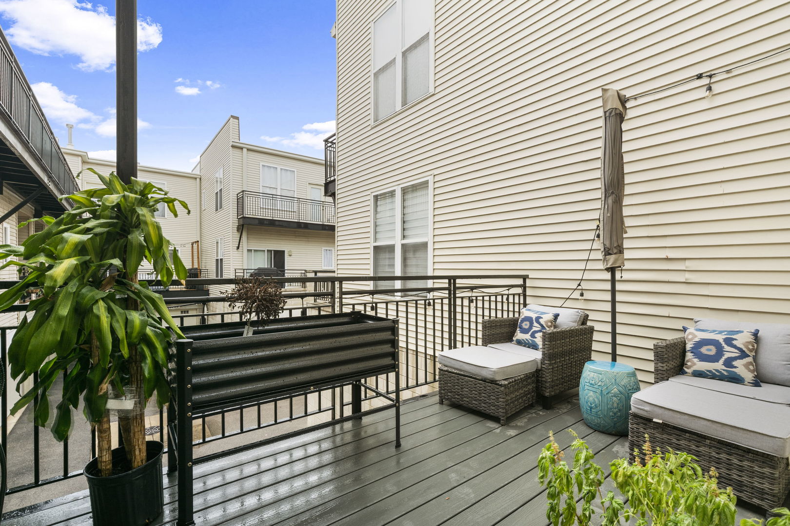 3238 North Kilbourn Avenue, Unit 1 Chicago, IL 60641 - Photo 7 of 17 a view of a patio with couches and potted plants