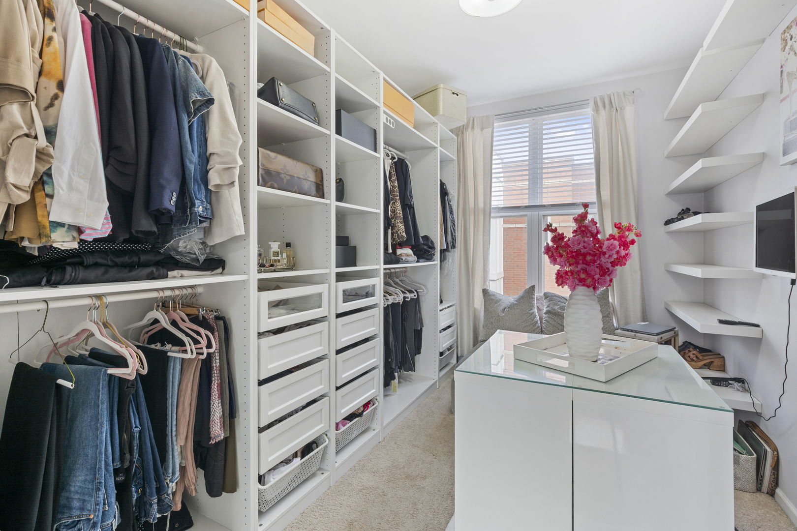 3238 North Kilbourn Avenue, Unit 1 Chicago, IL 60641 - Photo 10 of 17 a view of walk in closet with clothes and shoes