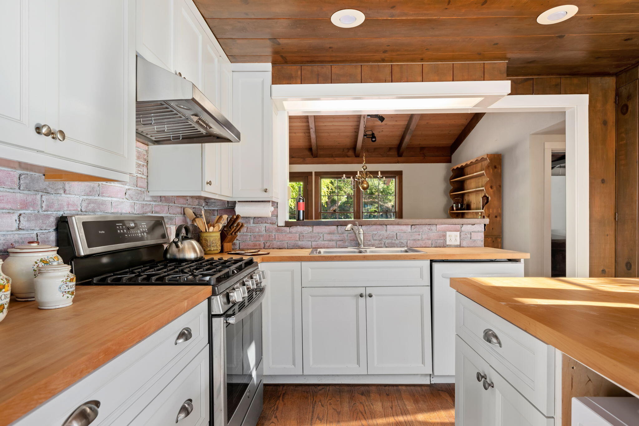1445 School House Road Montecito, CA 93108 - Photo 15 of 53 a kitchen with a sink stove and cabinets