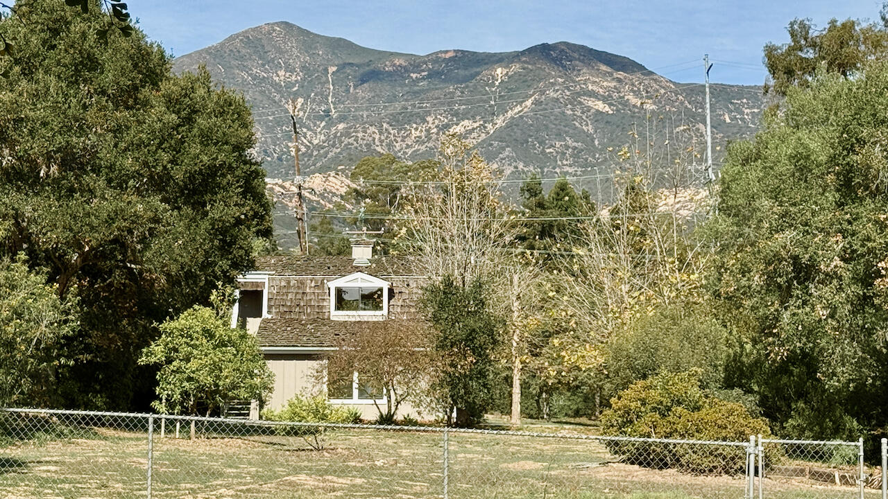 1445 School House Road Montecito, CA 93108 - Photo 37 of 53 a view of a house with a yard and a large tree