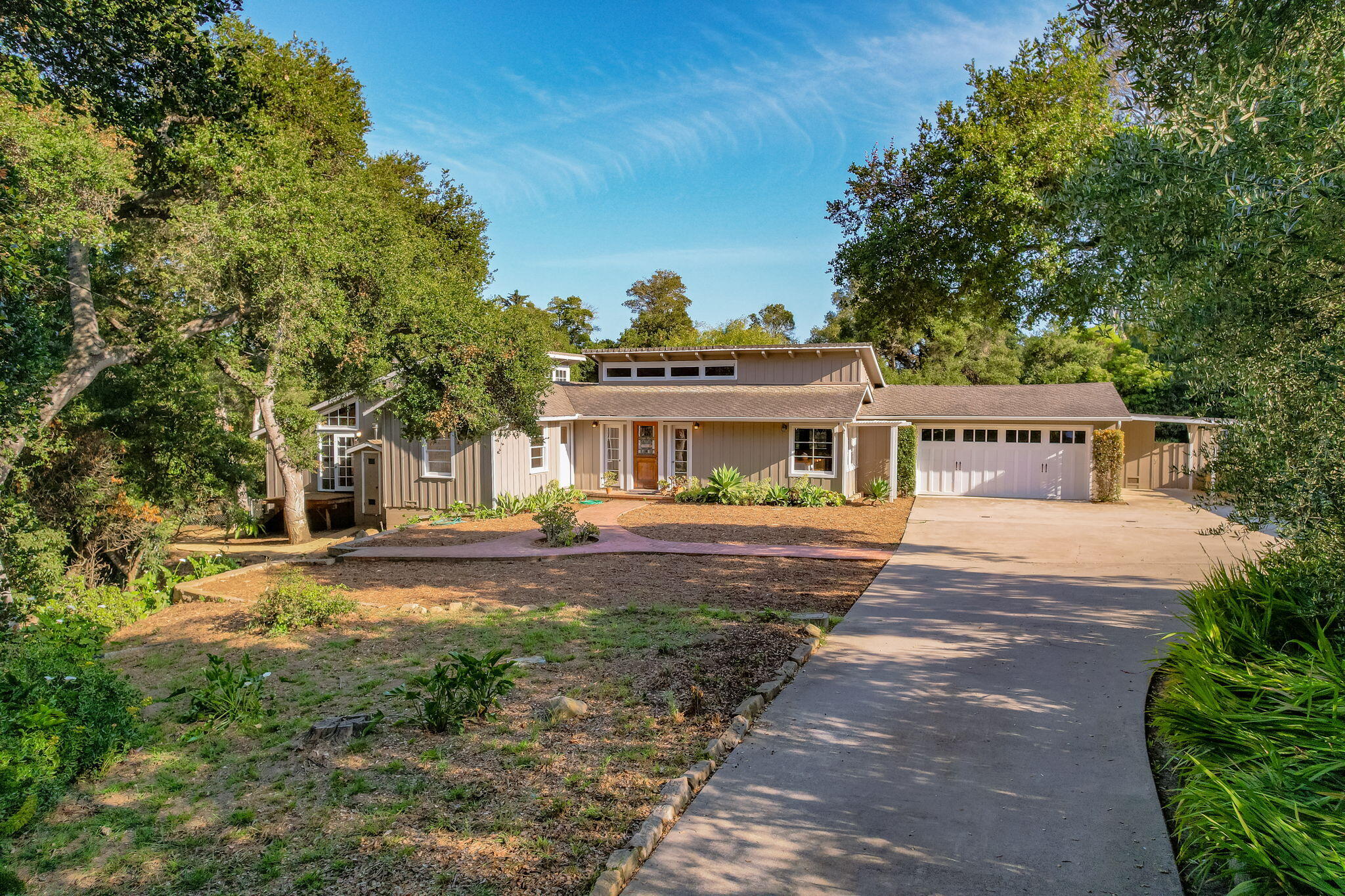 1445 School House Road Montecito, CA 93108 - Photo 7 of 53 a front view of house with yard space and trees around