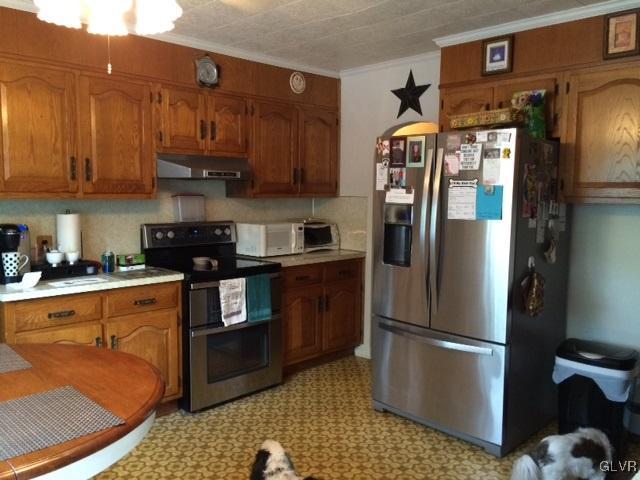 2020 Blue Barn Road Orefield, PA 18069 - Photo 4 of 15 a kitchen with stainless steel appliances granite countertop a refrigerator a stove and a sink with wooden floors