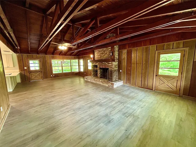 a view of an empty room with a fireplace