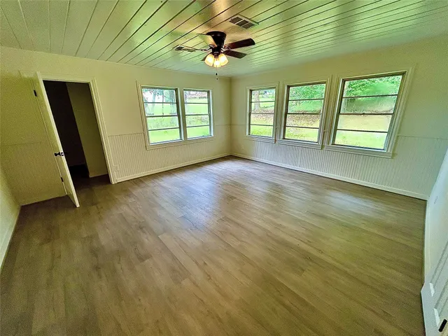 a view of an empty room with windows