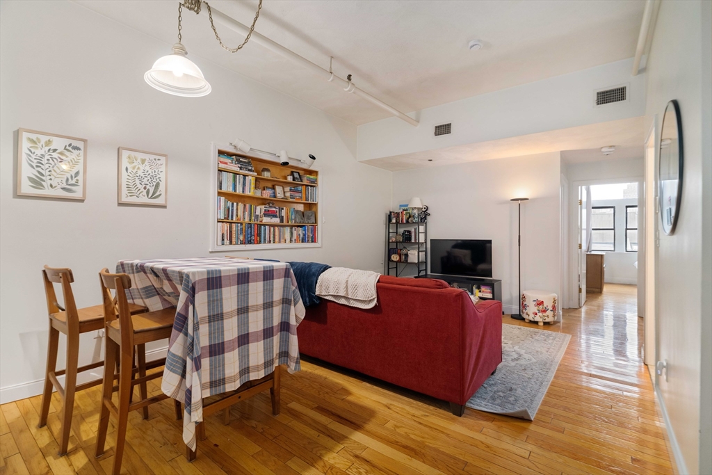 188 North Street, Unit 53 Boston, MA 02113 - Photo 1 of 14 a bedroom with furniture and wooden floor