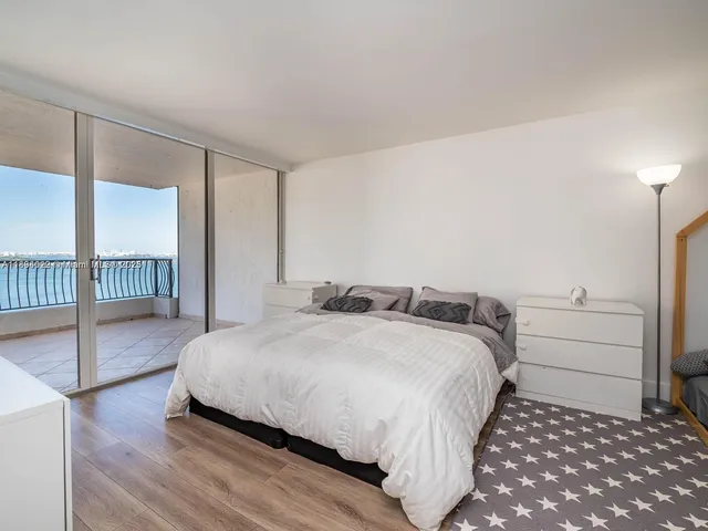 a bedroom with a bed and a walk in closet