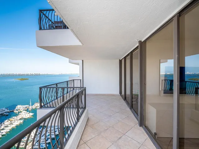 a view of a balcony with an ocean view