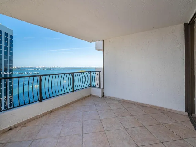 a swimming pool with outdoor seating