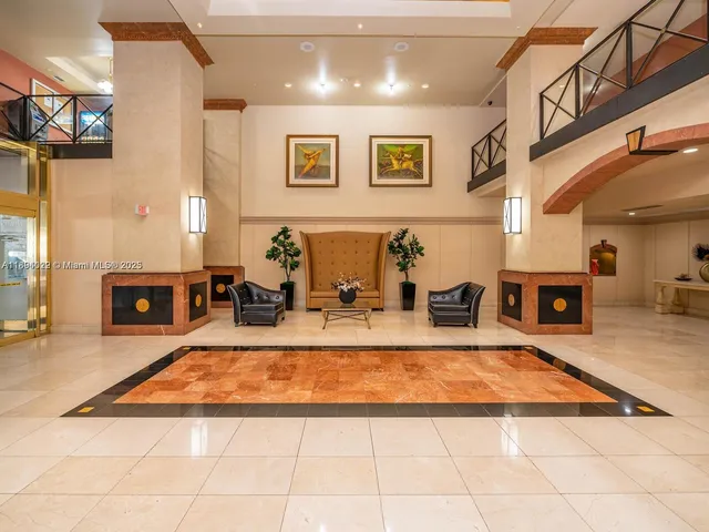 a view of an ocean with boats and trees in the background