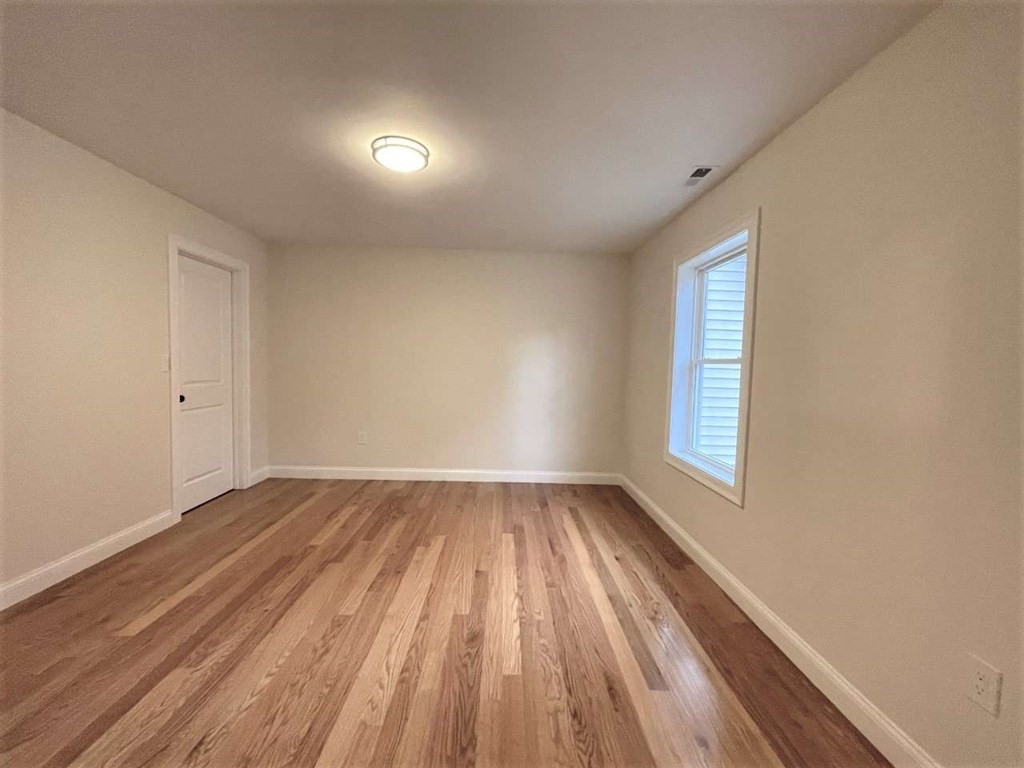 28 Line Road, Unit 1 Wakefield, MA 01880 - Photo 14 of 20 a view of an empty room and window