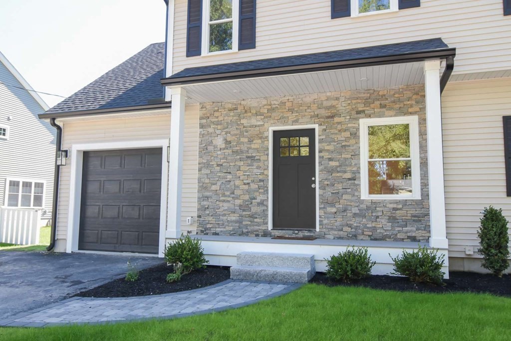 28 Line Road, Unit 1 Wakefield, MA 01880 - Photo 2 of 20 a front view of a house with garden