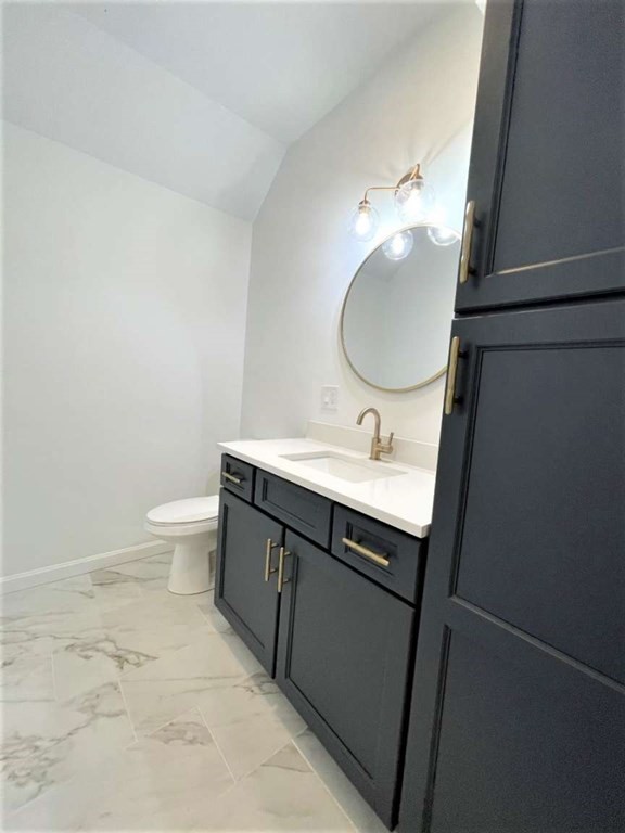 28 Line Road, Unit 1 Wakefield, MA 01880 - Photo 3 of 20 a bathroom with a sink and a mirror