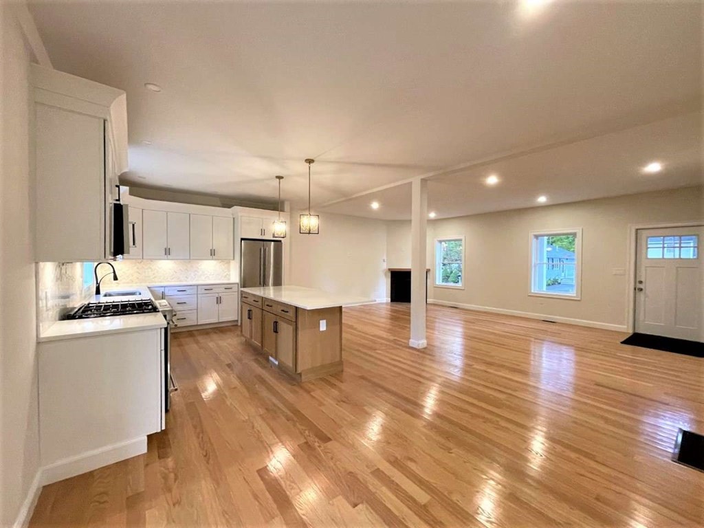 28 Line Road, Unit 1 Wakefield, MA 01880 - Photo 6 of 20 a view of kitchen with cabinets and wooden floor