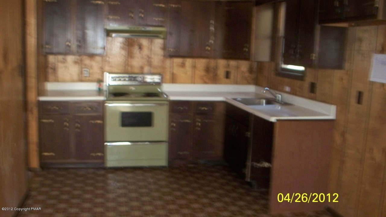 262 Decker Road Bushkill, PA 18324 - Photo 3 of 8 a kitchen with a sink and a stove