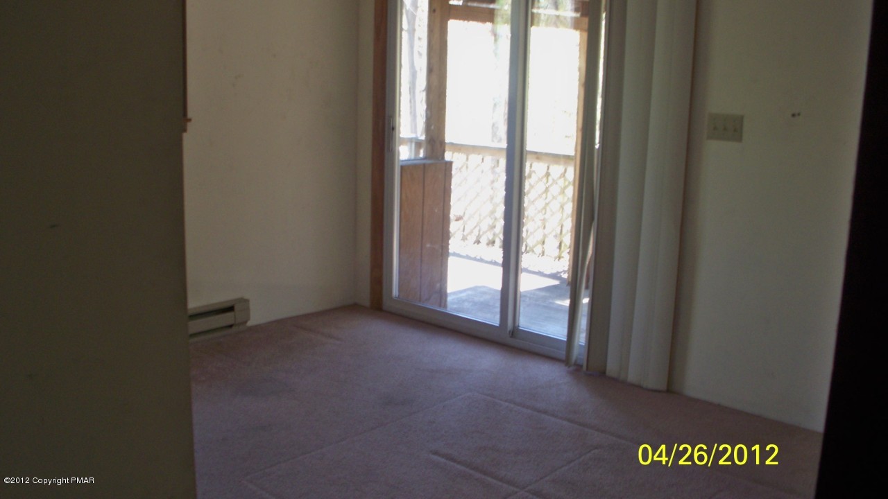 262 Decker Road Bushkill, PA 18324 - Photo 4 of 8 a view of an empty room with a window