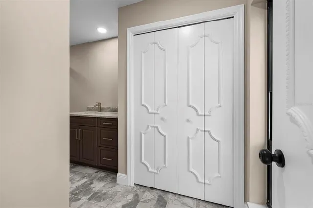 a view of a hallway with wooden floor and a floor to ceiling window