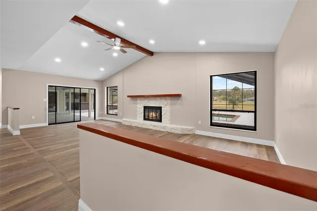a bathroom with a double vanity sink and mirror with bathtub