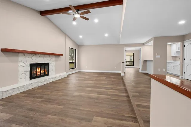 a large bathroom with a tub a sink a mirror and a shower