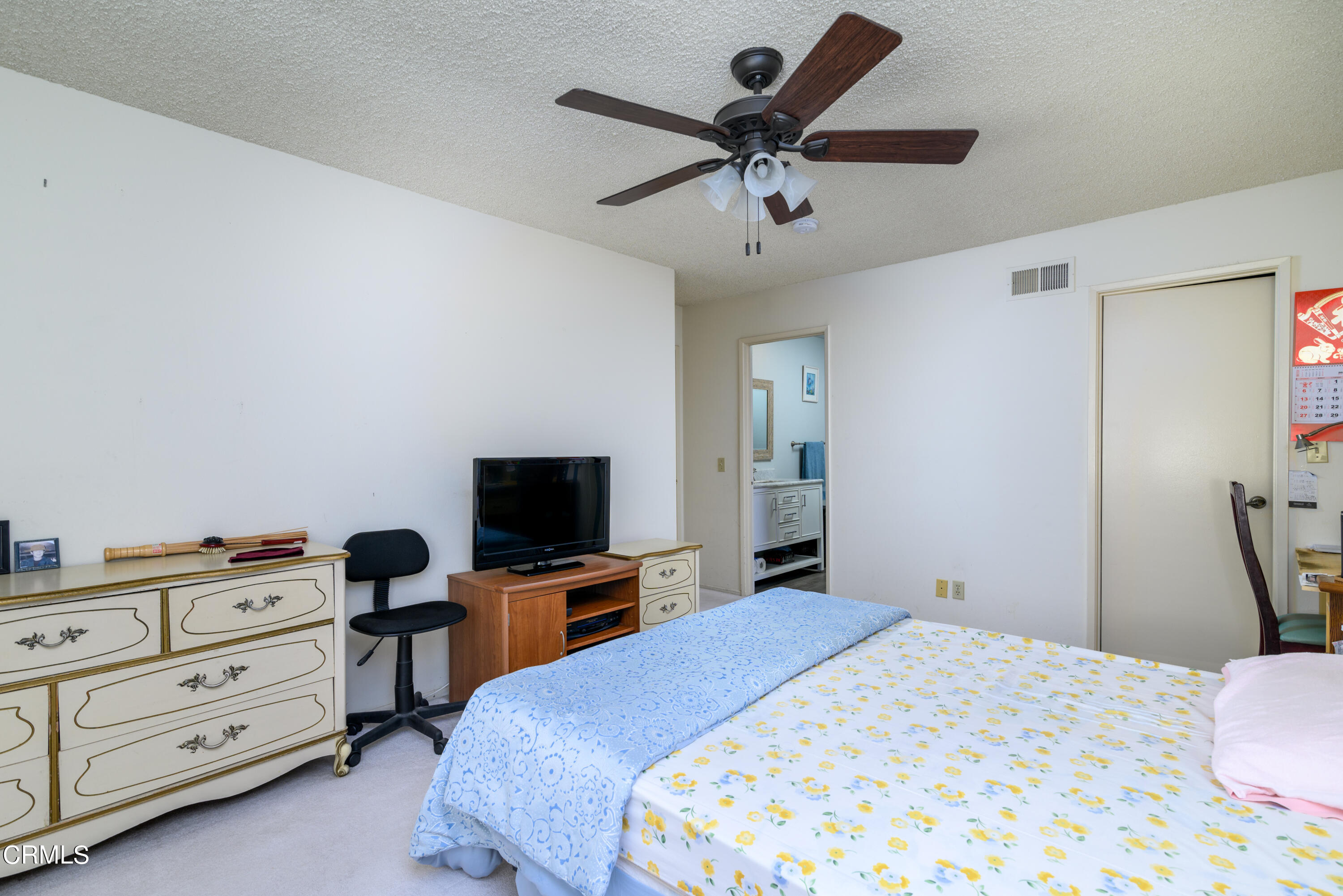 2564 Roxy Street Simi Valley, CA 93065 - Photo 11 of 25 a bedroom with a bed and a flat tv screen on dresser