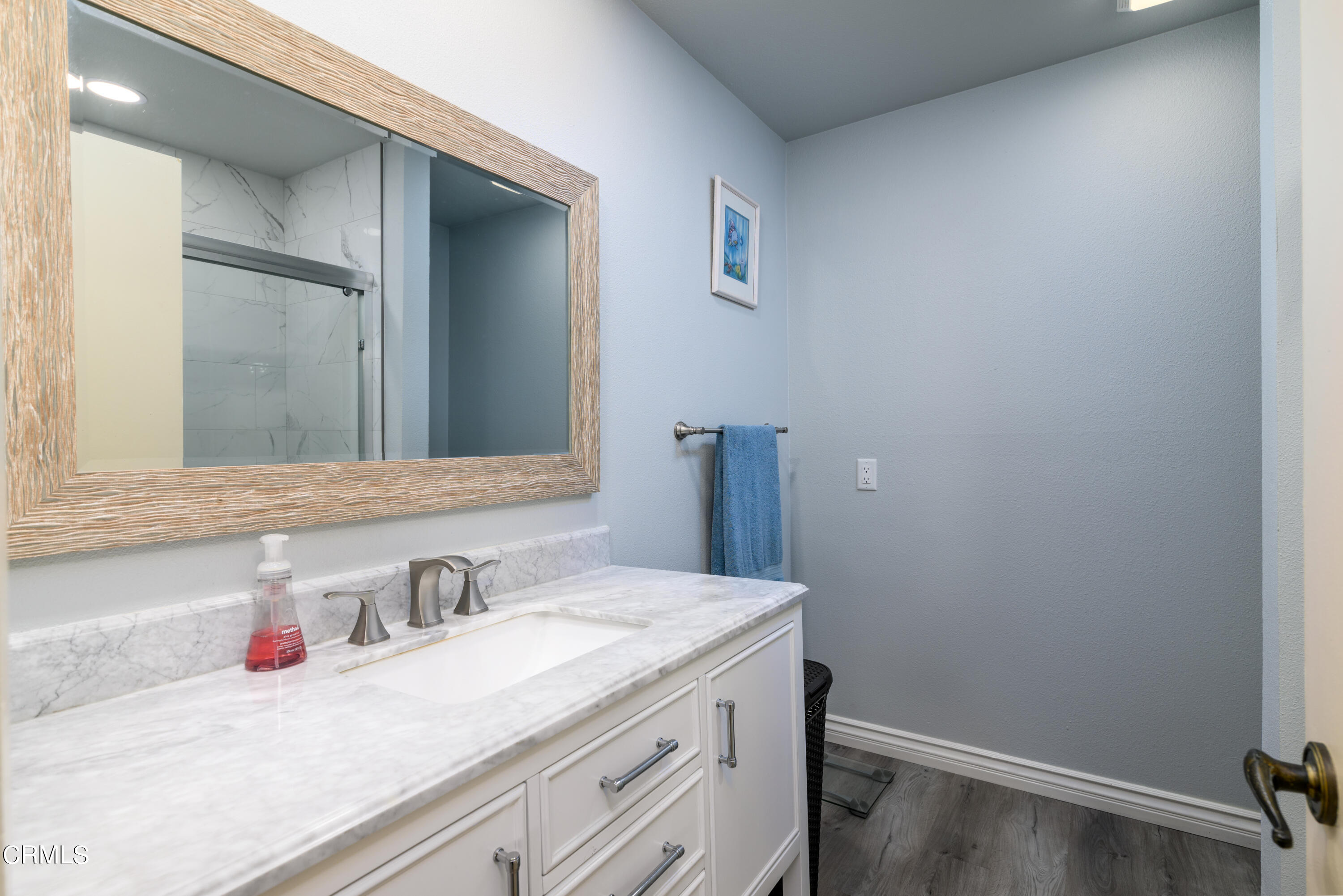 2564 Roxy Street Simi Valley, CA 93065 - Photo 12 of 25 a bathroom with a sink and a mirror