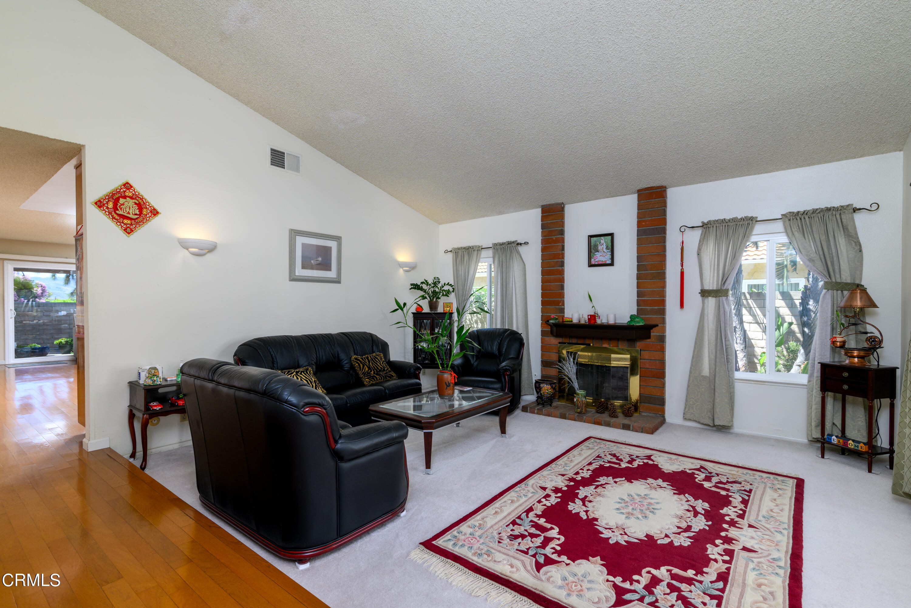 2564 Roxy Street Simi Valley, CA 93065 - Photo 4 of 25 a living room with furniture and a fireplace
