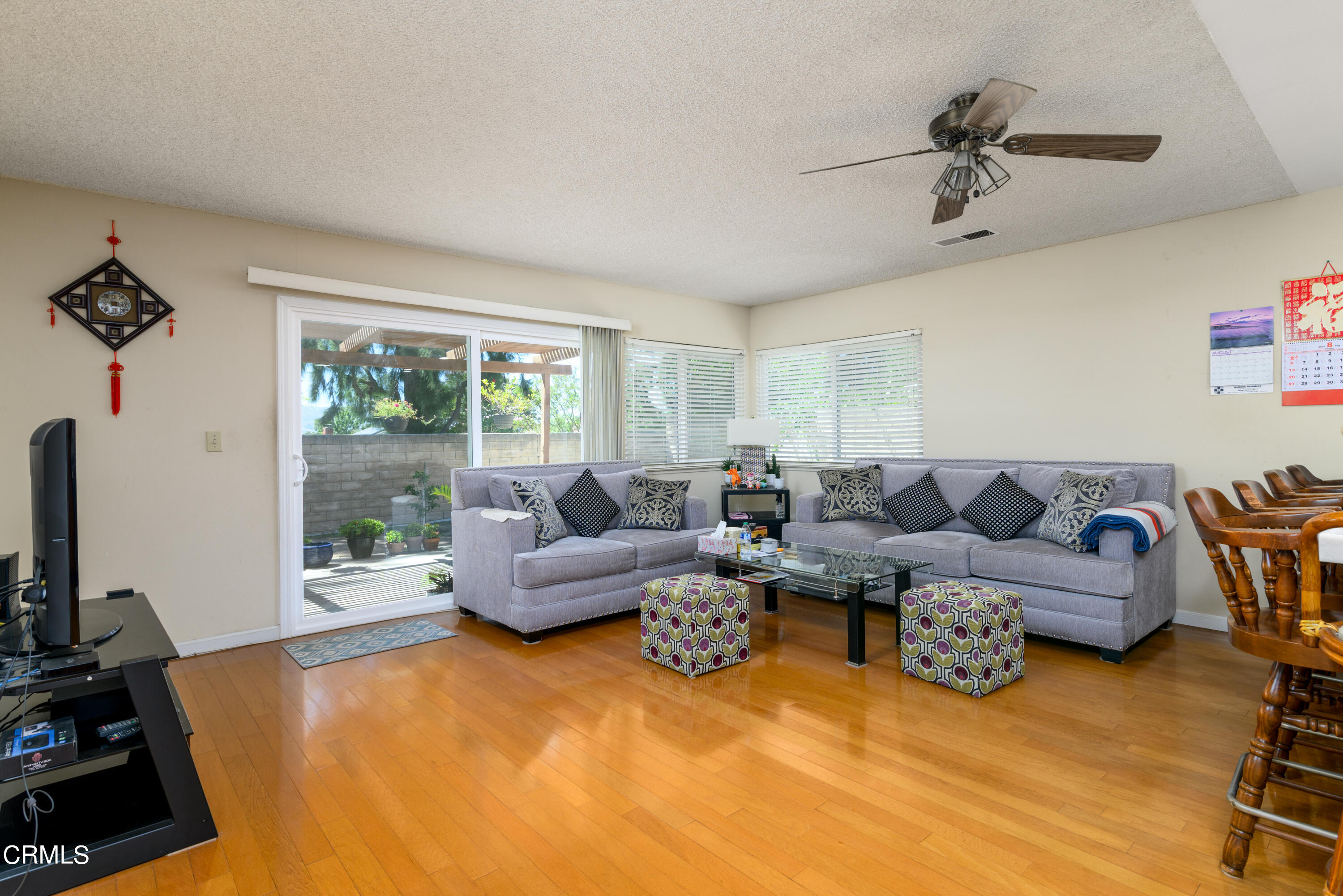 2564 Roxy Street Simi Valley, CA 93065 - Photo 8 of 25 a living room with furniture and a flat screen tv