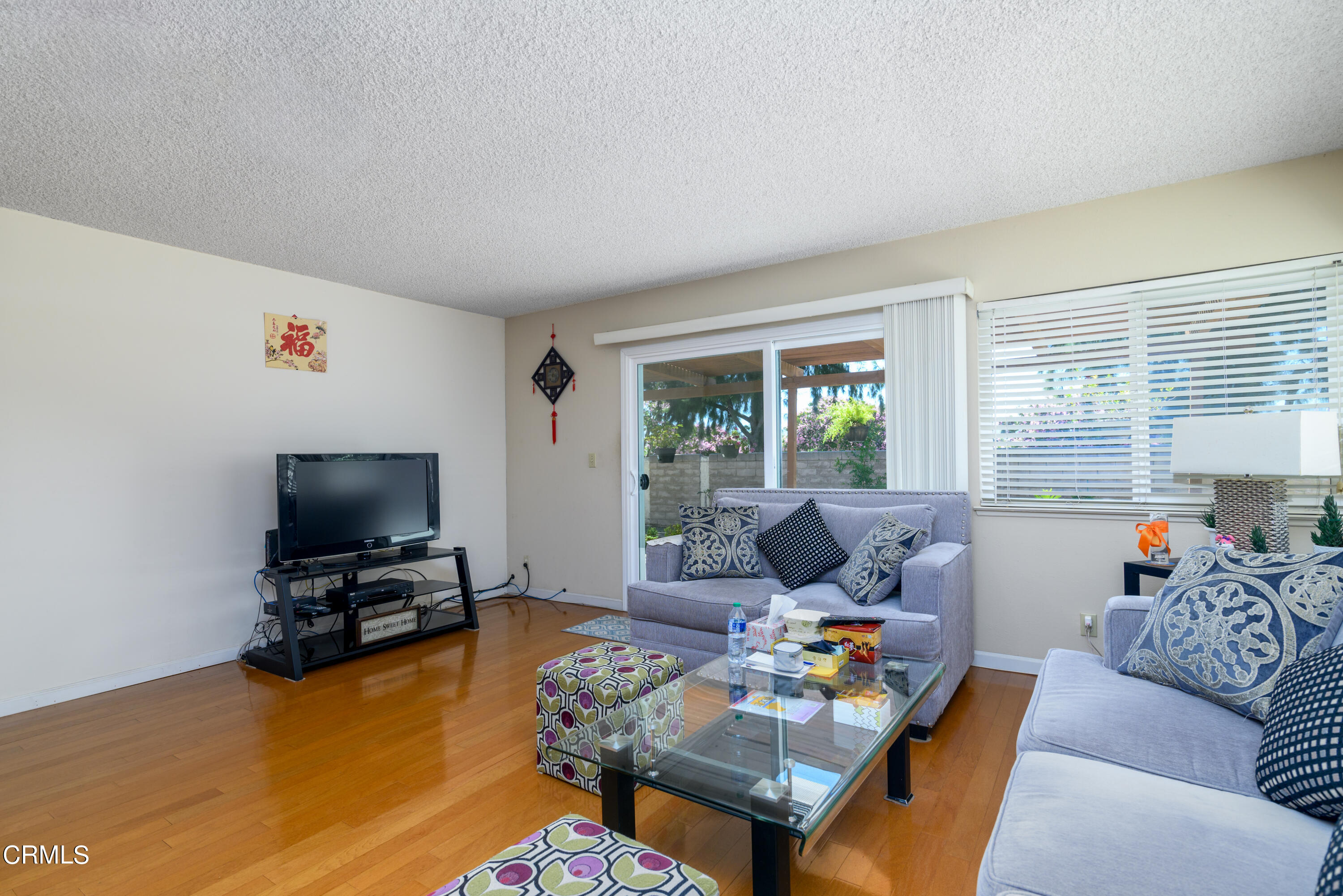 2564 Roxy Street Simi Valley, CA 93065 - Photo 9 of 25 a living room with furniture and a flat screen tv