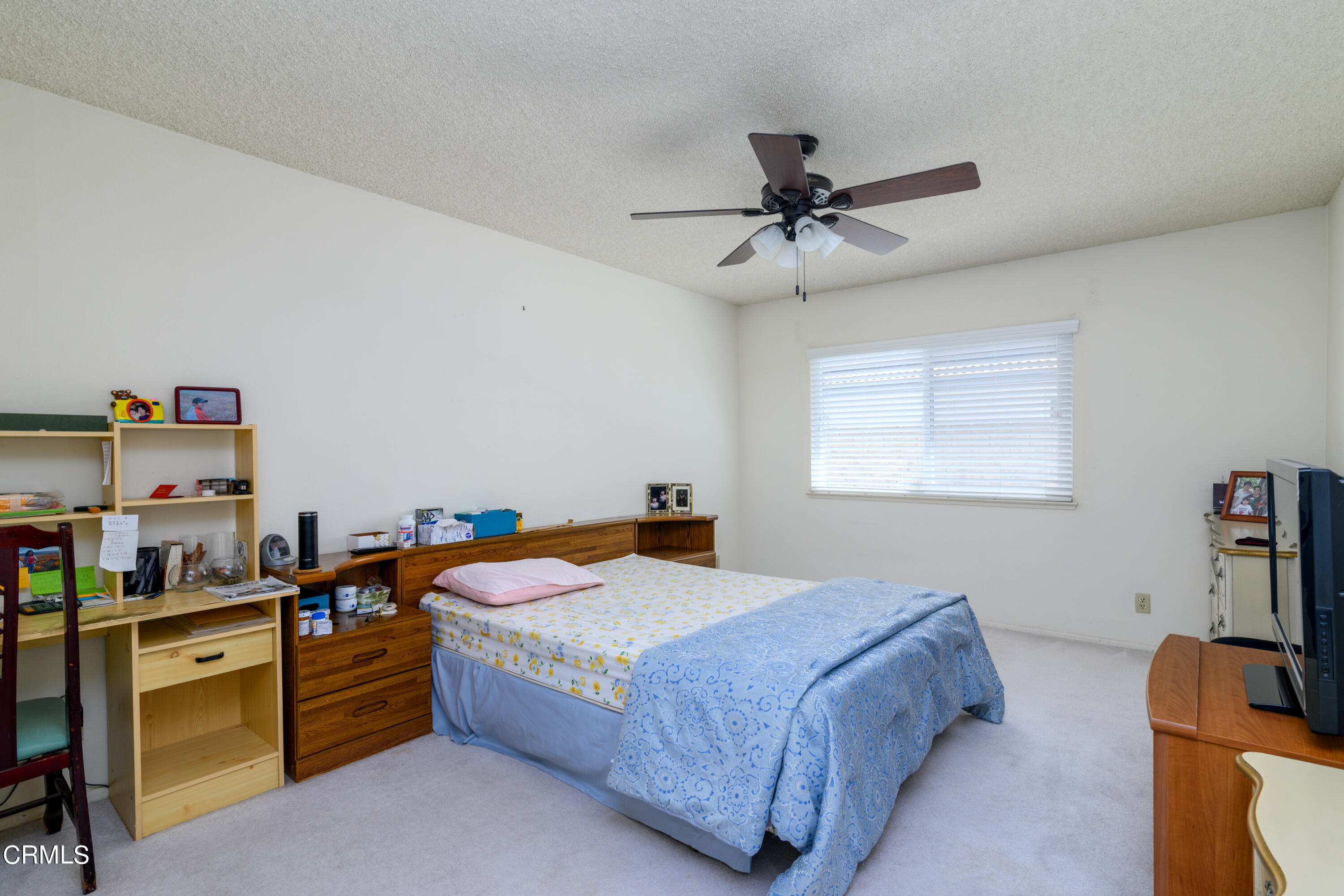 2564 Roxy Street Simi Valley, CA 93065 - Photo 10 of 25 a bedroom with a bed and furniture