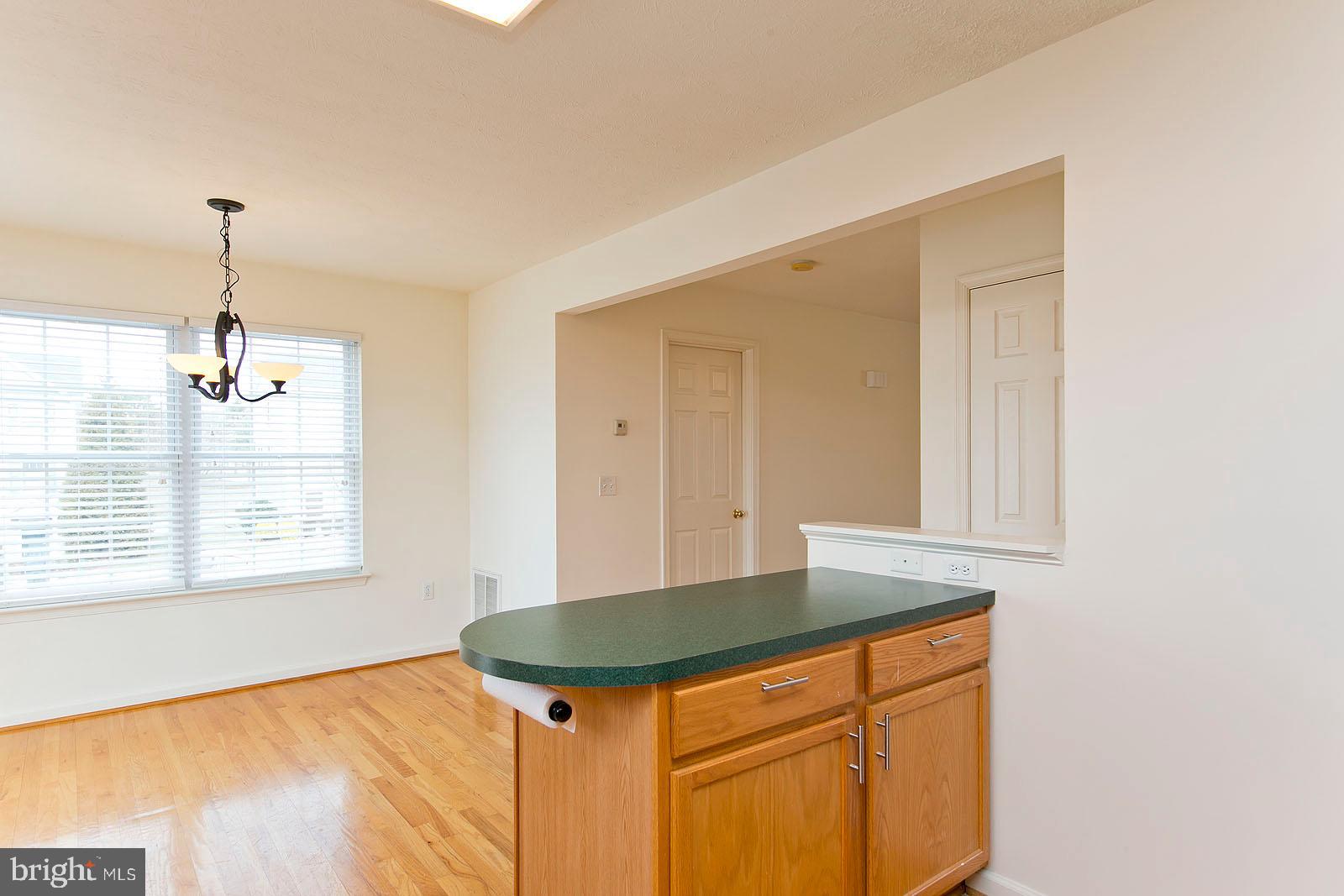 100 Scirocco Lane Winchester, VA 22602 - Photo 15 of 37 a view of room with window and wooden floor