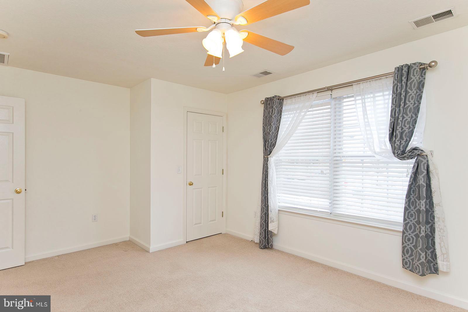 100 Scirocco Lane Winchester, VA 22602 - Photo 20 of 37 a view of an empty room with a window