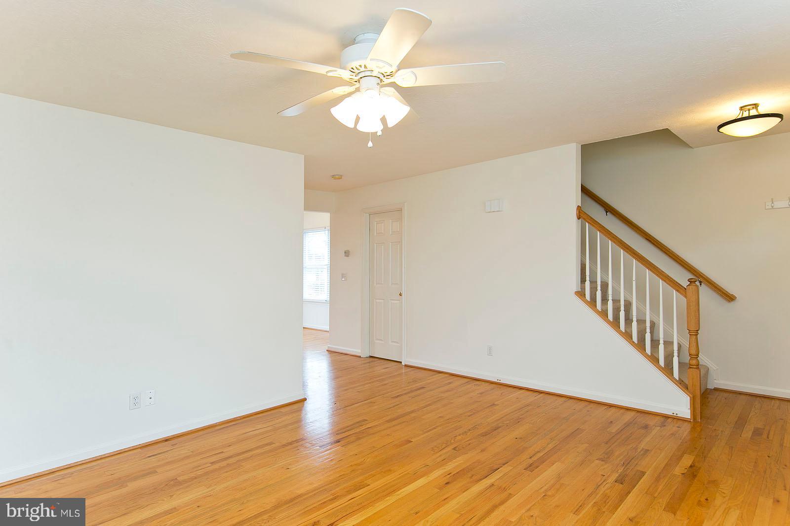 100 Scirocco Lane Winchester, VA 22602 - Photo 3 of 37 a view of an empty room with wooden floor